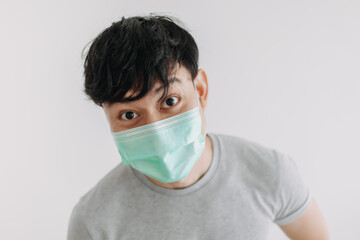 Close up of Happy Asian man wears mask isolated on white background.