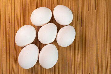 White eggs on the raw pasta