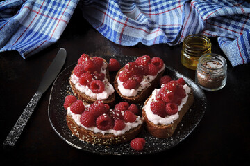 Toast with fresh raspberries and shrimp paste. A gourmet snack. Keto food.