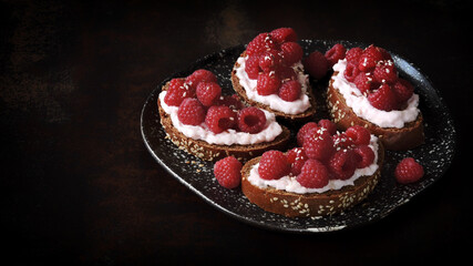 Toast with fresh raspberries and shrimp paste. A gourmet snack. Keto food.