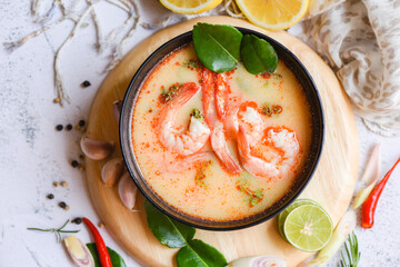 shrimp soup bowl, seafood soup with shrimps prawns in the restaurant, Traditional thai cuisine hot spicy soup shrimp curry with herb and spices Thai food , top view