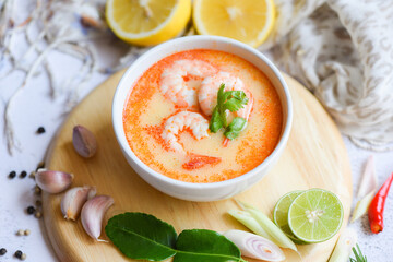 shrimp soup bowl, seafood soup with shrimps prawns in the restaurant, Traditional thai cuisine hot spicy soup shrimp curry with herb and spices Thai food , top view