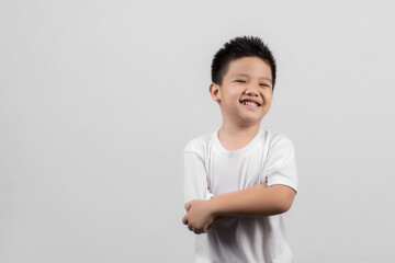 Obraz premium Smart little Asian boy studio portrait on gray background