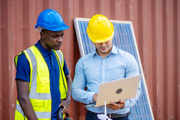 Two male energy engineers team discussing new project about to invest in install solar cells outside building or industrial factory