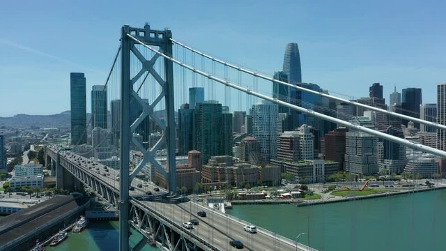 flying alongside Oakland Bay Bridge towards San Francisco