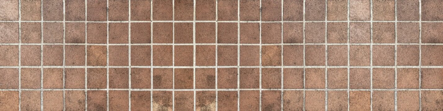 Panorama of Brown terracotta wall tiles texture and background seamless