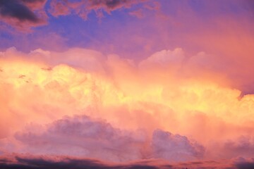 Heaven background.Sky.Multicolored clouds. Summer weather. Clouds of blue, lilac, yellow and pink colors. Heaven at Sunset.Colorful summer  sky.Summer time