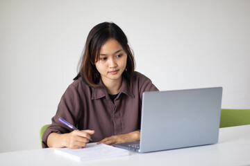 Portrait of beautiful young woman working in the office.