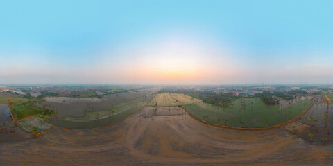 360 panorama by 180 degrees angle seamless panorama of aerial view of Dong Tan trees in green rice field in national park at sunset in Sam Khok. Nature landscape tourist attraction in travel trip.