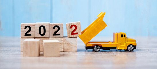 2022 Happy New year with miniature truck or construction vehicle. New Start, Vision, Resolution,...