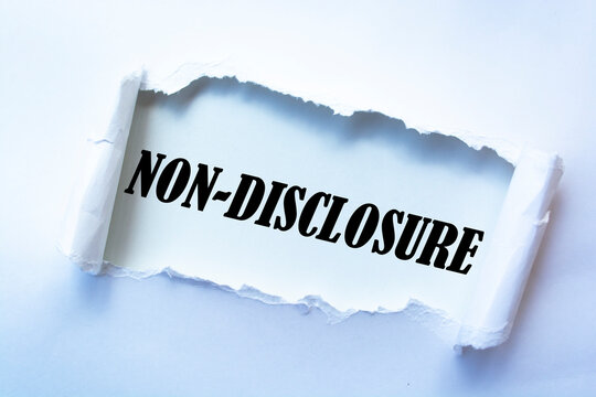Non-Disclosure word written under torn paper.