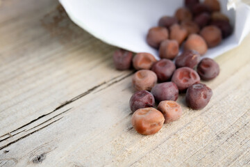 Purple snow pea seeds for planting in the garden. Heirloom purple mist snow peas. Pea plants produce stunning edible purple flowers with purple pods. Selective focus with defocused seed package.