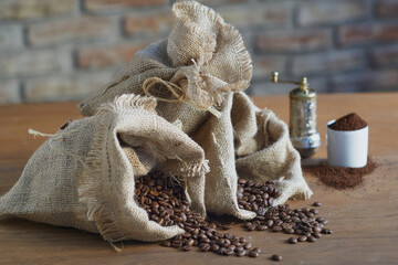 Bags of roasted coffee beans on a wooden table