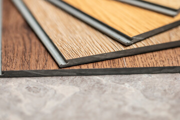 close up on vinyl click lock sheet for interior designer selection items for customer new floor design 