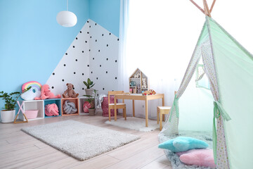 Interior of modern children's room with play tent © Pixel-Shot