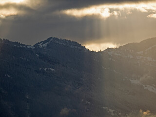 fanned out sun light over the mountain