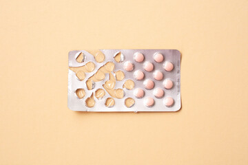 Medicine and pills. Tablet packaging started. Plate with tablets on a beige background.