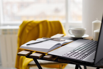 black laptop keyboard on white window background. Distant work. Online training. Home office