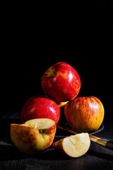 Fototapeta na wymiar A few apples on a plate on a black background