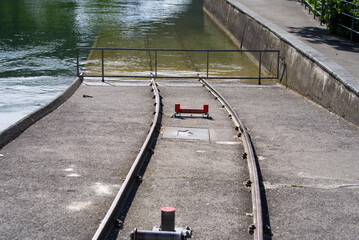 Tracks leading into river Limmat at power station. Photo taken May 10th, 2021, Zurich, Switzerland.