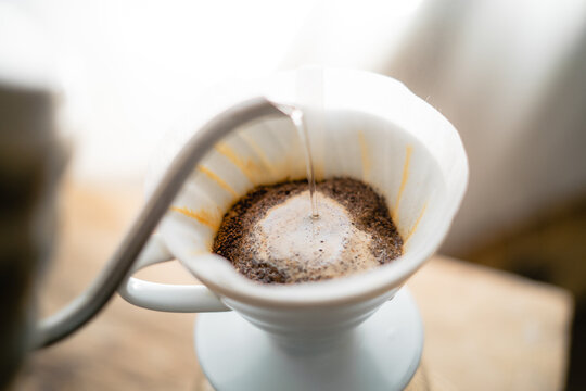 Pouring a hot water over a drip coffee