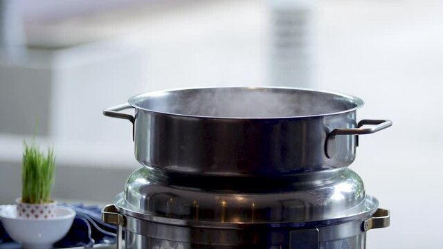 Boil water in a cooking pot.