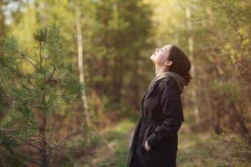 girl woman walking in nature park forest and breathing fresh air. concept of breathing, inhaling,...