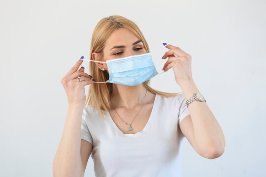 Portrait of young woman wearing face protective mask to prevent Coronavirus and anti-smog. Portrait of young woman wearing face mask. Covid-19 prevention concept