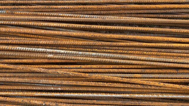 Rusty rebar lies folded close-up. Construction Materials