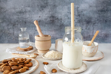 Close-up of homemade almond milk with an ecological bamboo straw
