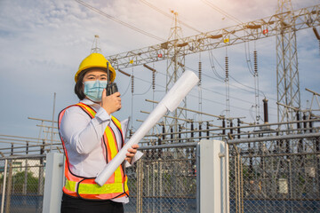 Women Engineer hold blueprint , Worker wear mask protect covid19 , Women use Radio communication