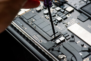 close up of Technician repairing electronic circuit board, repairing, upgrade and technology.
