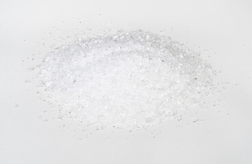 handful of crystalline citric acid on white