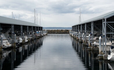 Fototapeta na wymiar Rows of moored boats in Edmond marina