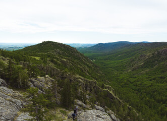 evergreen fir forest on a hilltop among the mountains of the National Park of the Republic of Bashkortostan on Lake Bannoye