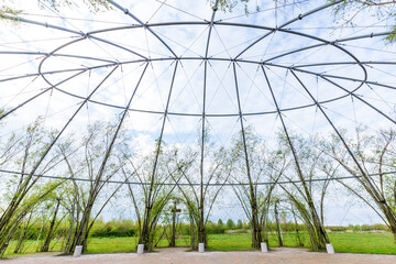 Fototapeta premium Natural green dome in park along Oldambt lake surrounding newly developed city Blauwestad in Oldambt Groningen in The Netherlands with natural green dome.