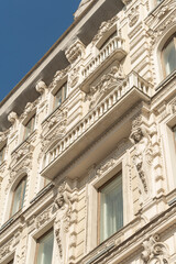 Statues of the four Atlanteans on the facade of a historic building on Nevsky Prospect of St. Petersburg.