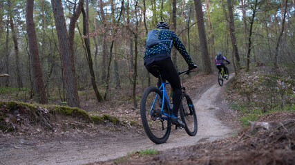 man on mountain bike in spring forest near utrecht in holland