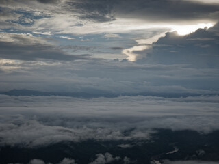 Fototapeta na wymiar sunrise cloud clusters in open air blue sky abrove the mountain