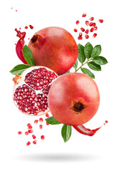 Ripe pomegranates levitate on a white background. Background with pomegranate fruit. Horizontal.