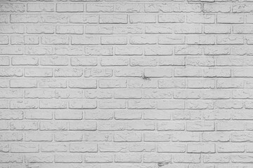 White and gray brick background with bumpy and rough texture.