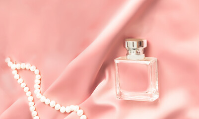 Womens perfume. Aroma beauty product, personal care concept. glass flask, female toilet water bottle on pink background.