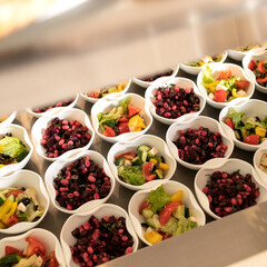 Mixed Vegetables Salad Sets. Variety of delicious and healthy meals in Self-service restaurant. Abundance of vitamin snacks or vegetarian food. Catering concept. Square format. Close up, top view.