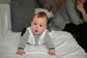 Portrait of cute little baby relaxing on a sofa