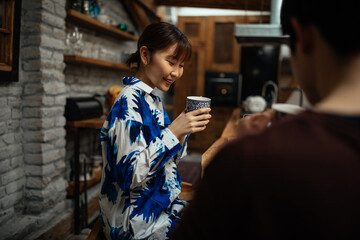 Japanese couple drinking coffee at home