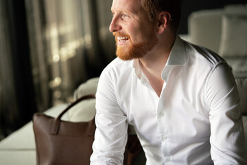 Portrait of a handsome young businessman smiling