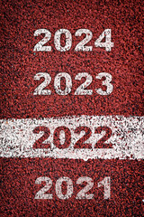 New year 2022 to 2024 on road surface with marking lines. Happy new year concept and business...