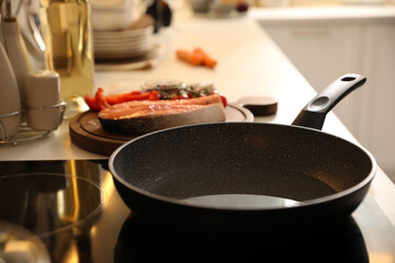 Frying pan with cooking oil on cooktop