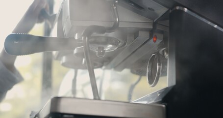 Hand of barista cleaning steam and smoke warm the milk from coffee machine, Vaporizer by streaming...