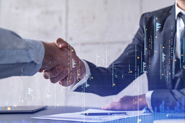 A handshake symbolize a capital market transaction to proceed profitable business in stock trading....